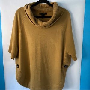 Tan slough peck pullover sweater with two buttons.